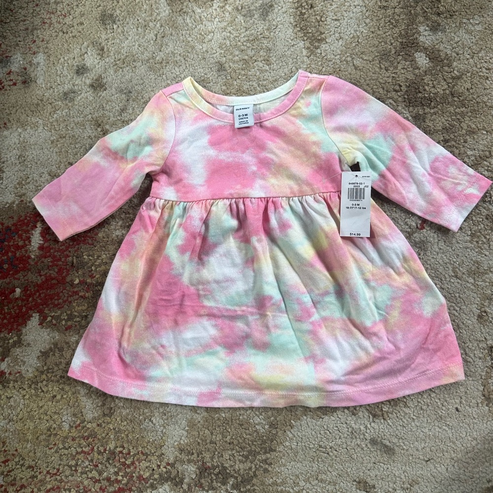 Brand new with tags adorable tie dye baby girl long sleeved dress.